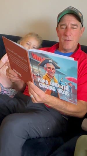 Woman reacting to a custom humorous book featuring her as the main character